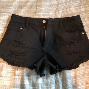 black ripped shorts